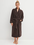 Women model is wearing Bathrobe 120 cm made of Cotton in Brown, Unicoloured from the Alpine LW series by CALIDA, Front view